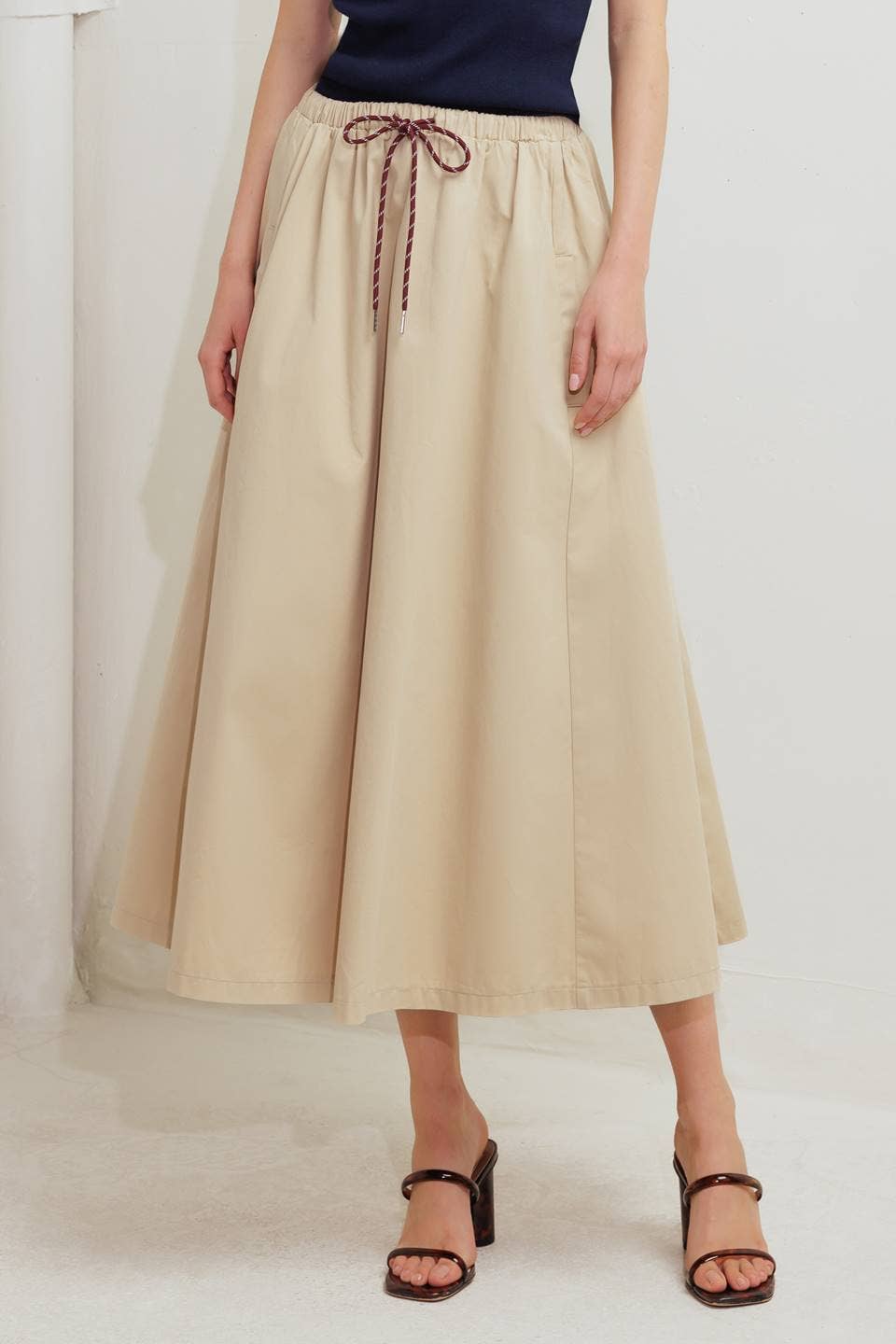 A solid woven midi skirt