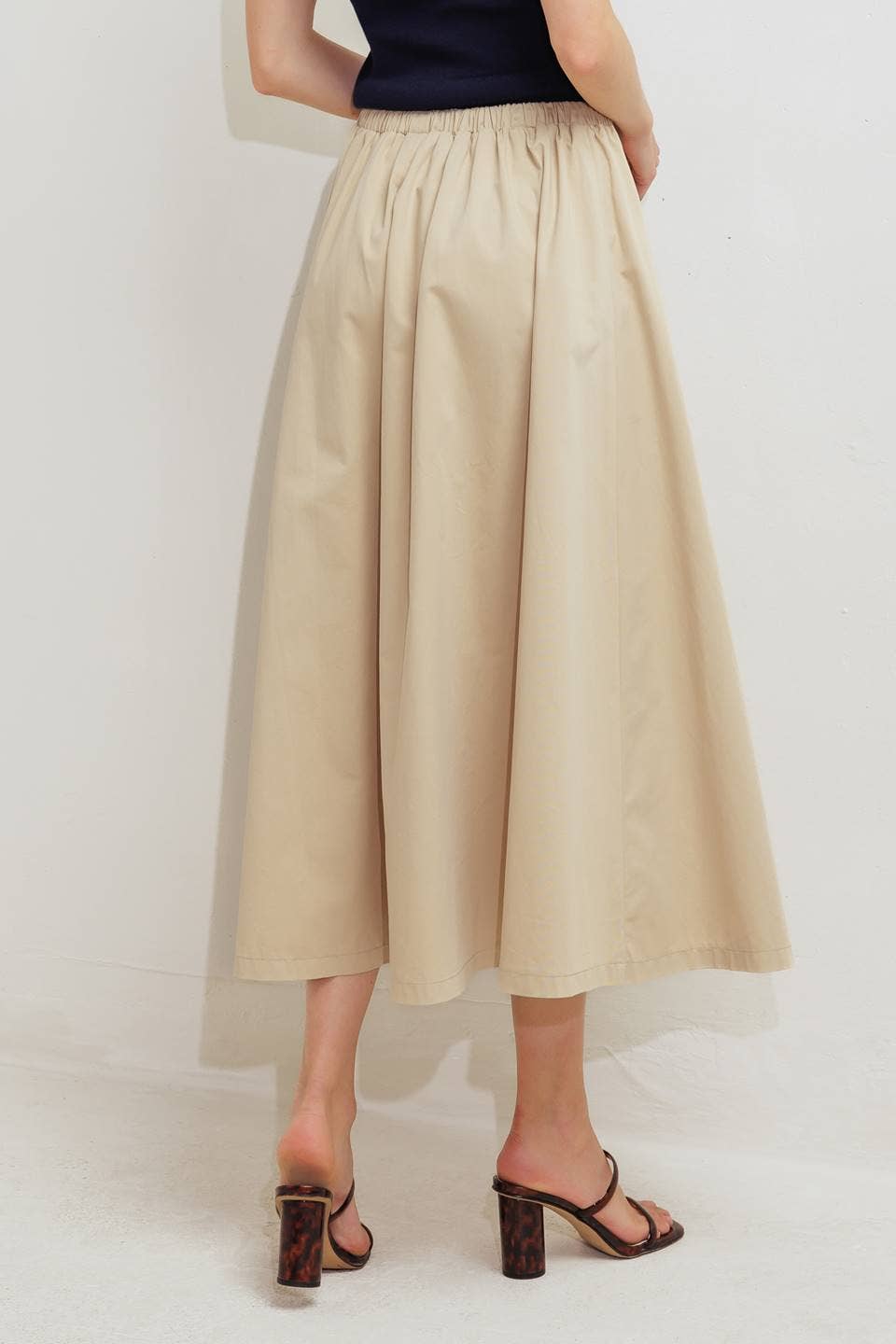 A solid woven midi skirt